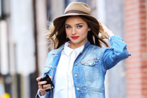 Victoria's Secret model Miranda Kerr holds onto her hat in windy New York City as she goes out with her dog Frankie